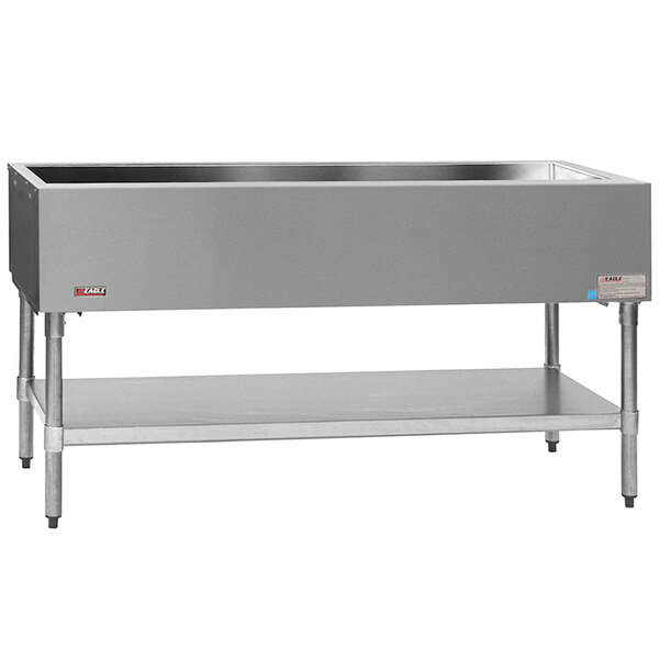 A stainless steel rectangular container on an Eagle Group cold food table with a galvanized undershelf.