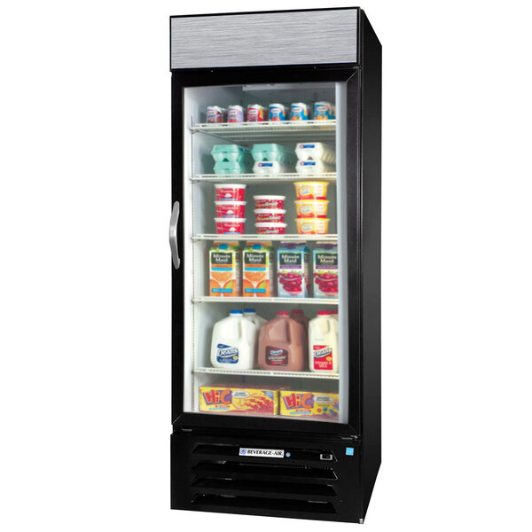 A Beverage-Air black glass door refrigerator with stainless steel interior full of dairy products including a white jug of milk.