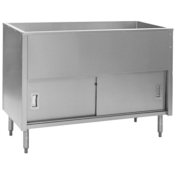 A stainless steel Eagle Group cold food table with sliding doors over a sink.
