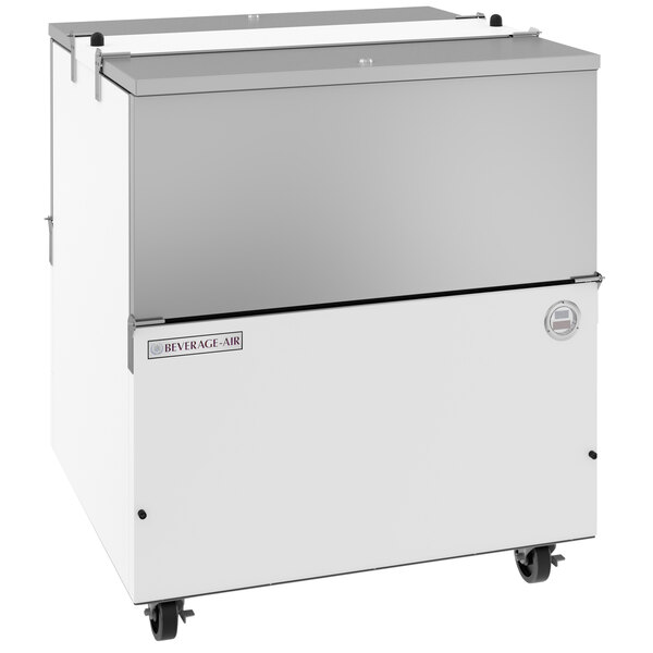 A white Beverage-Air milk cooler with stainless steel interior and wheels.