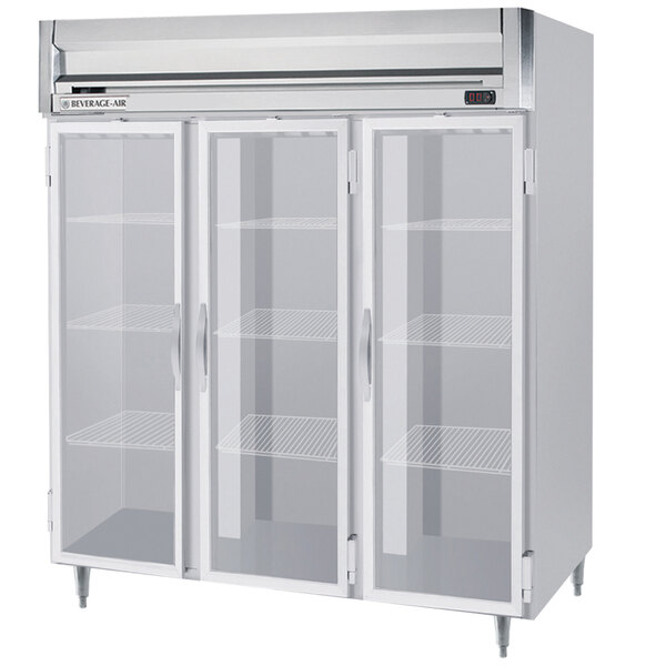 A white Beverage-Air reach-in refrigerator with three glass doors and shelves inside.