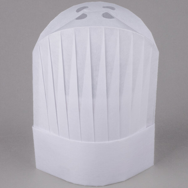 A close up of a white Royal Paper disposable chef hat with pleats.