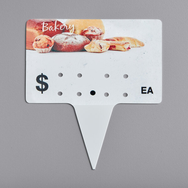 A Ketchum Manufacturing Bakery Molded Number Spear Price Tag with a picture of food on it.