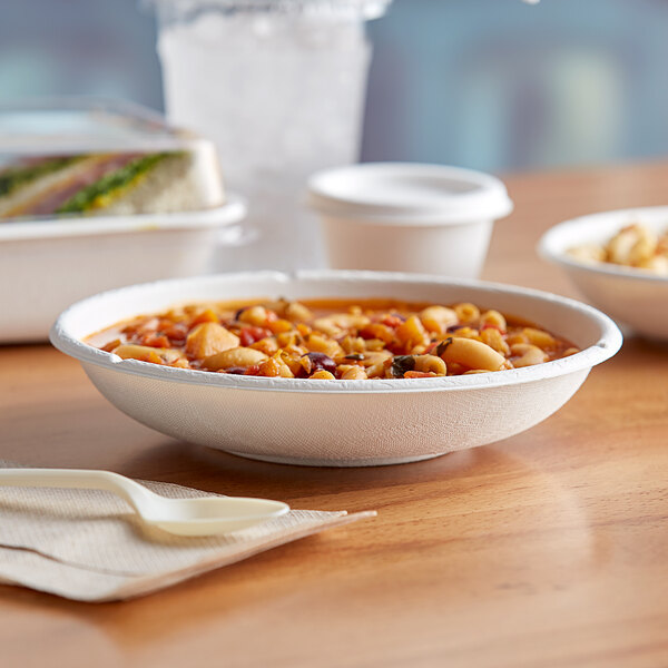 A bowl of food in a white Eco-Products compostable bowl on a table.
