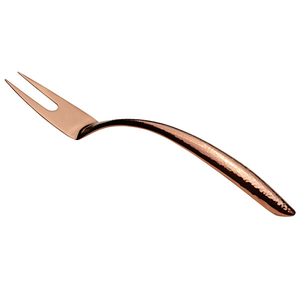 A close-up of a Bon Chef rose gold hammered stainless steel serving fork with a hollow handle.