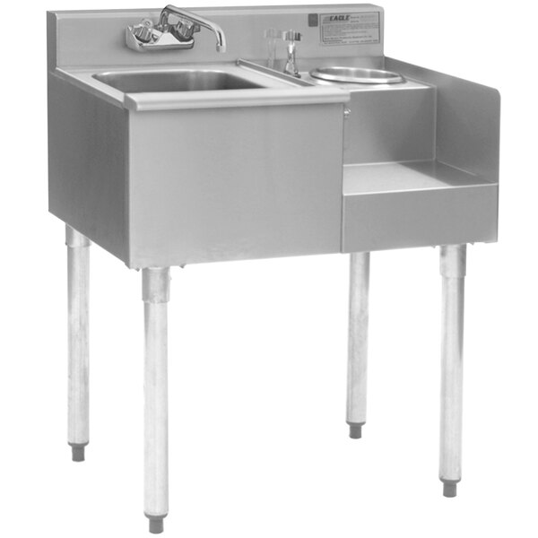 A stainless steel Eagle Group underbar sink with a faucet.