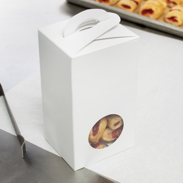 A white candy box with a window in it.