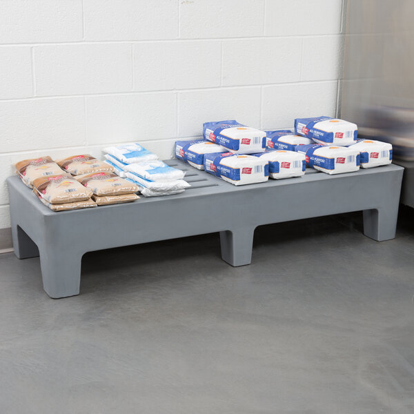 A Winholt dunnage rack with bags and packages on it.