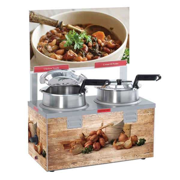 A Nemco soup warmer with two pots of soup on display.