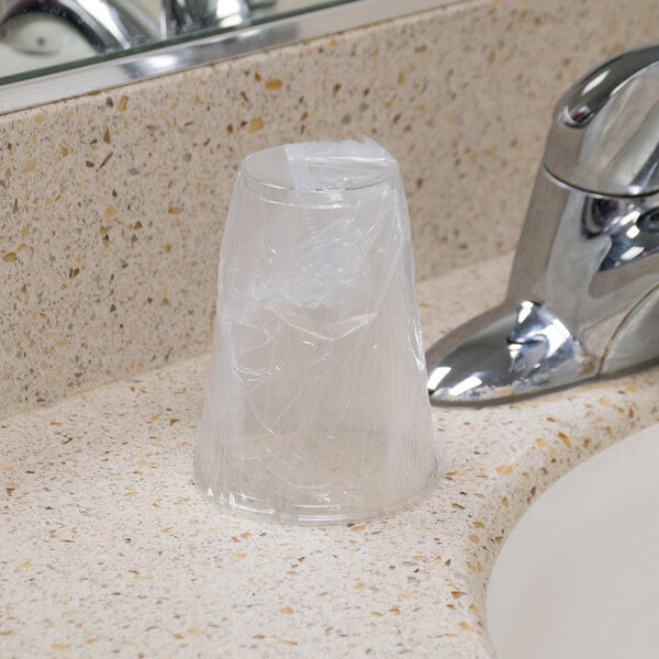 A Solo Ultra Clear plastic cup individually wrapped on a counter.