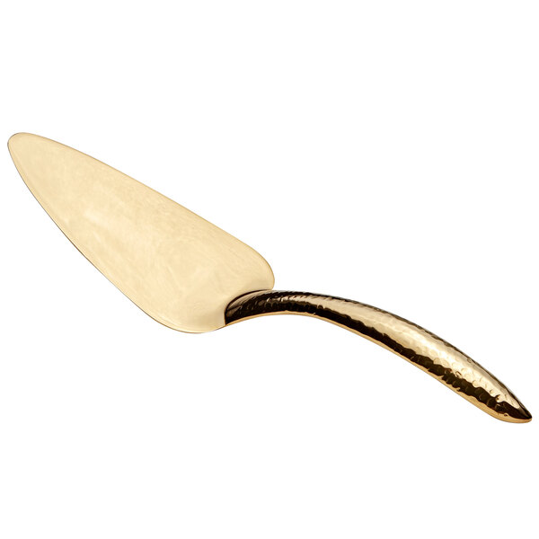 A Bon Chef stainless steel pastry server with a gold hammered handle.
