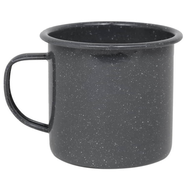 A black Crow Canyon Home enamelware mug with a speckled design on the side and a handle.