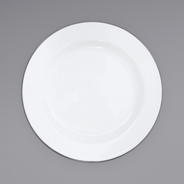 A white Crow Canyon Home enamelware plate with a grey rim.