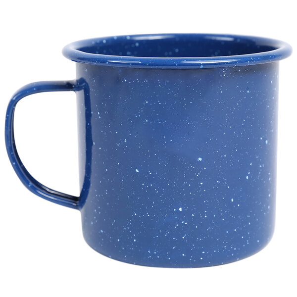 A medium blue Crow Canyon Home enamelware mug with speckles and a handle.