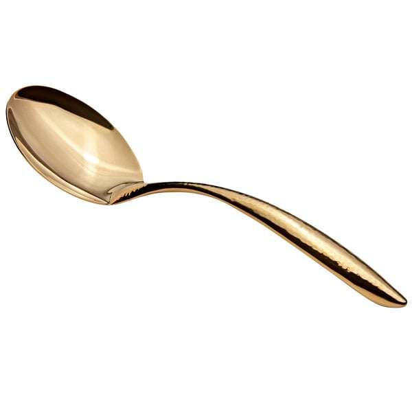 A Bon Chef stainless steel serving spoon with a gold hammered finish and long hollow handle.