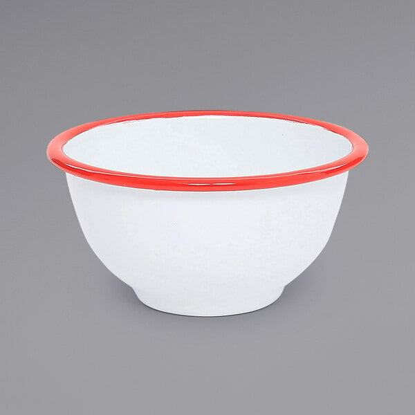 A white bowl with red rim.