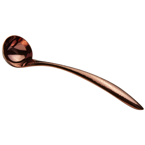 A close-up of a Bon Chef rose gold stainless steel serving ladle with a hammered handle.