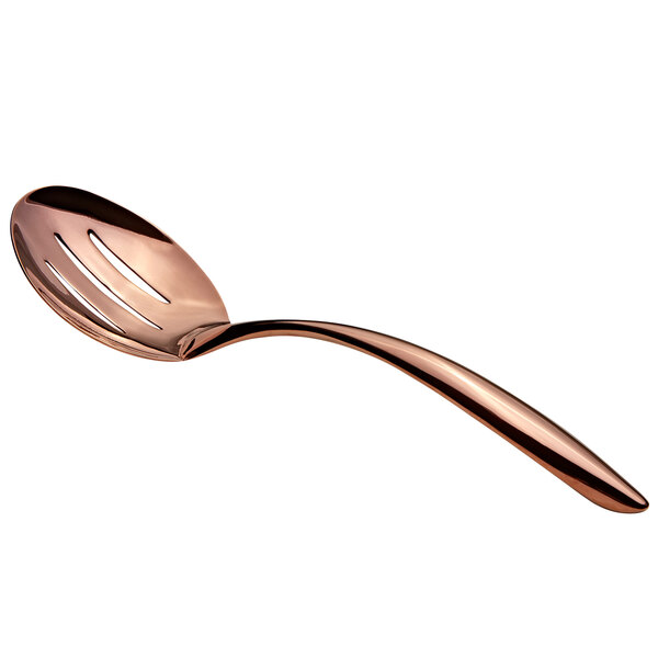 A close-up of a Bon Chef rose gold stainless steel slotted serving spoon with a hollow handle.
