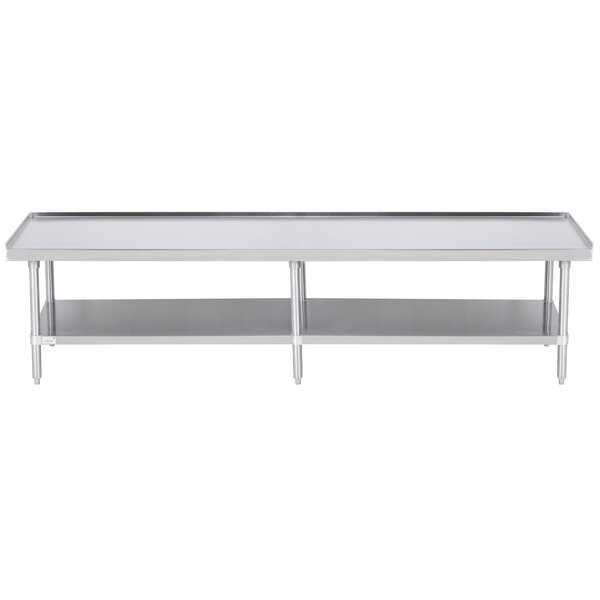 A long stainless steel table with a stainless steel undershelf.