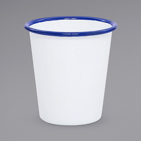A white cup with a blue rim.