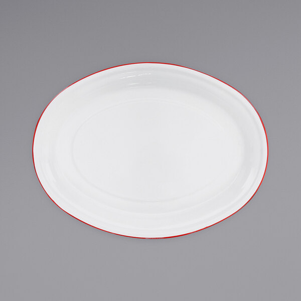 A white oval platter with red rolled rim.