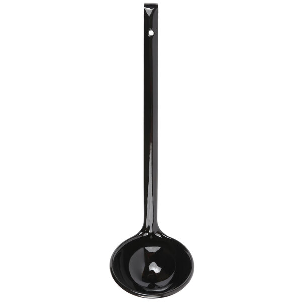 A black Crow Canyon Home enamelware ladle with a long handle.