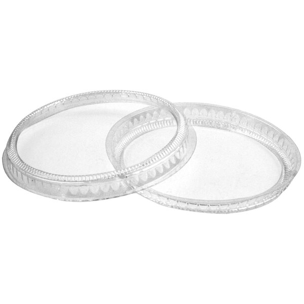 Two Solia clear round plastic lids.