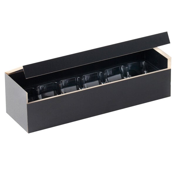 A black wooden case with a clear thermoformed frame with three compartments inside.