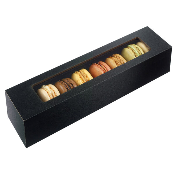 A Solia wooden case with a thermoformed frame holding 8 macarons.