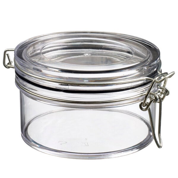 A clear plastic jar with a metal lid.