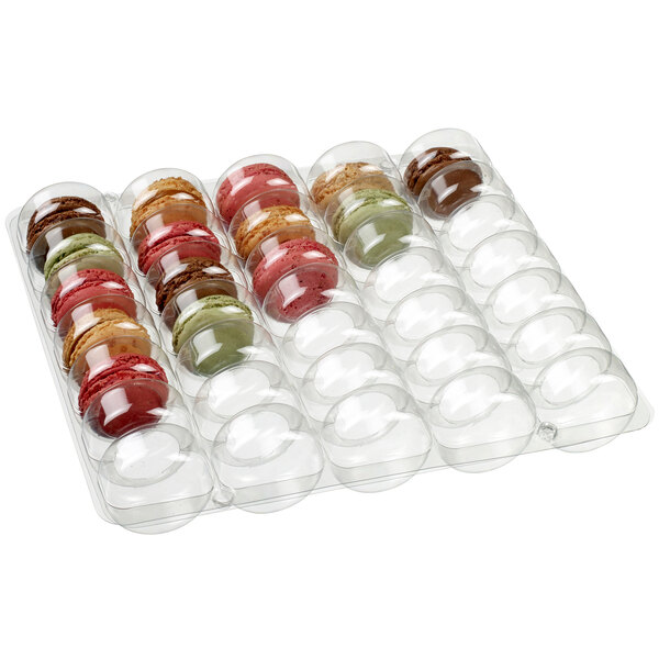 A clear Solia plastic tray holding several different colored macaroons.