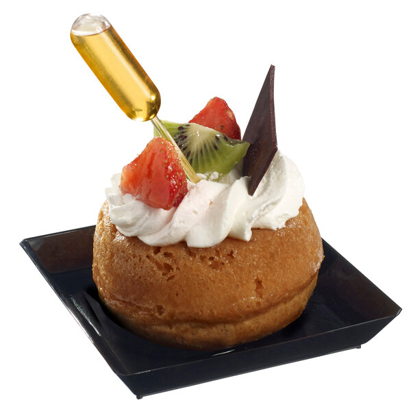 A small pastry with a Solia clear plastic pipette on top.