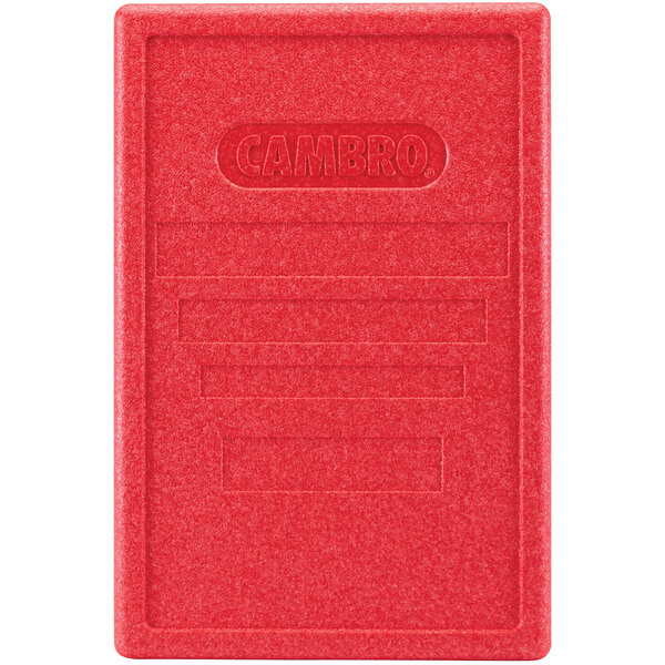 A red rectangular Cambro lid with text on it.