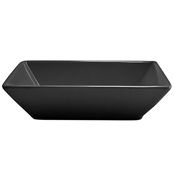 A black rectangular Front of the House Spiral Ink porcelain bowl with a white line.