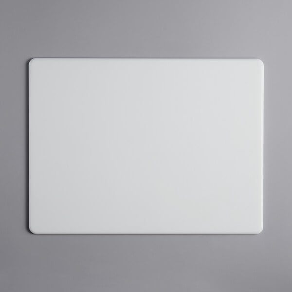 A white rectangular Tomlinson Chef's Edge cutting board.