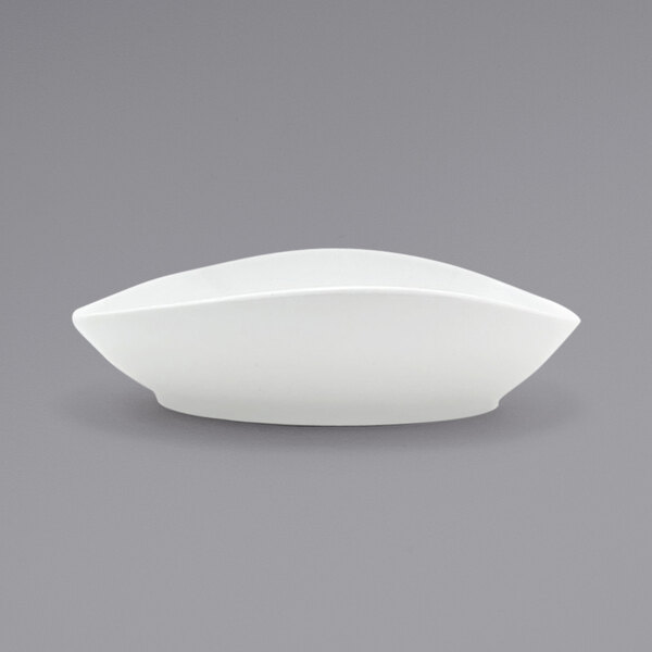 A Front of the House Tides white porcelain bowl with a curved edge on a white background.
