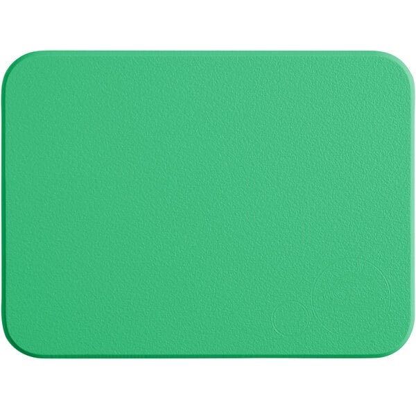 A green rectangular Tomlinson Chef's Edge cutting board.