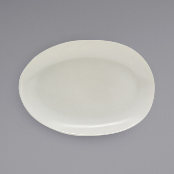 A white plate with a small oval shape on it.