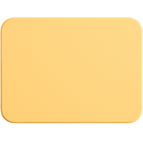 A yellow rectangular Tomlinson Chef's Edge cutting board.