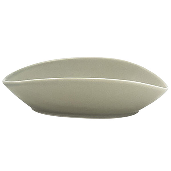 A Front of the House Tides porcelain ramekin with a curved edge.