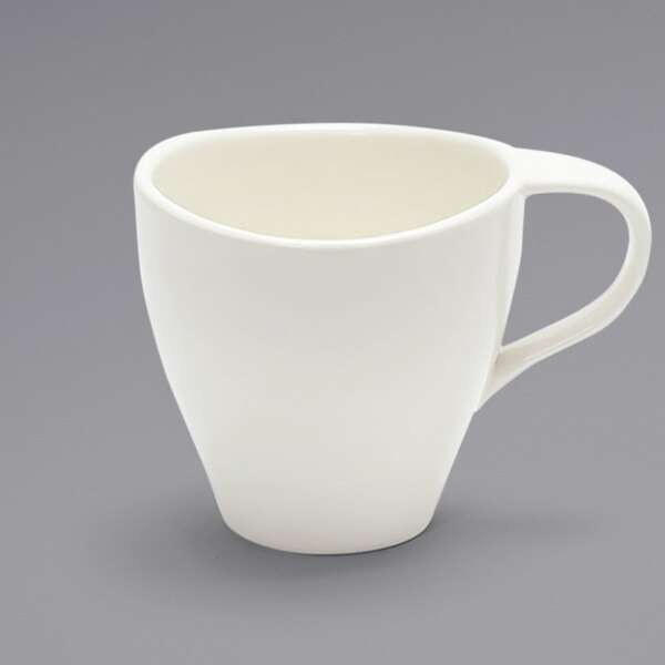A white Front of the House Tides porcelain coffee cup with a white handle.