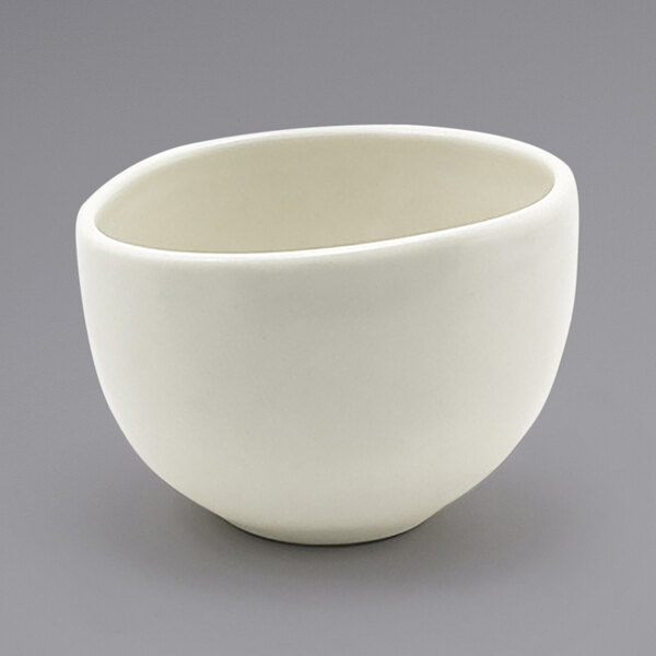 A close up of a white Front of the House Tides scallop round porcelain bowl.