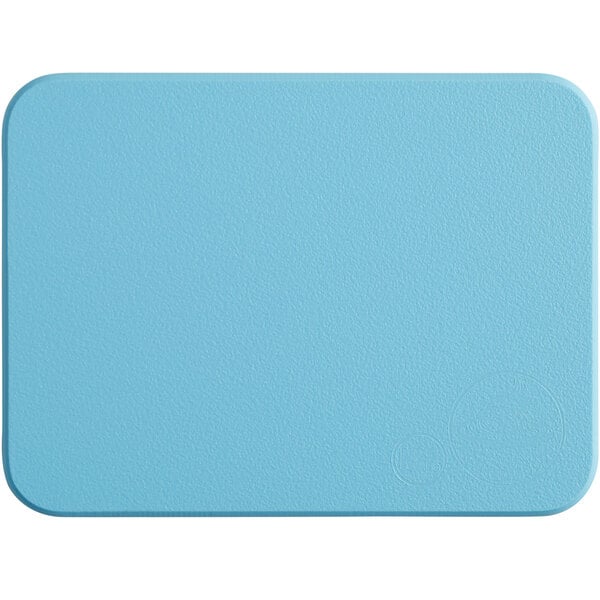 A blue rectangular Tomlinson Chef's Edge cutting board with a white border.
