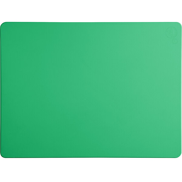 A green rectangular cutting board on a white surface.