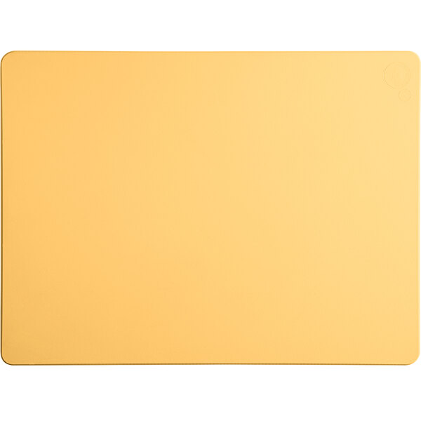 A yellow rectangular Tomlinson Chef's Edge cutting board with a white border.