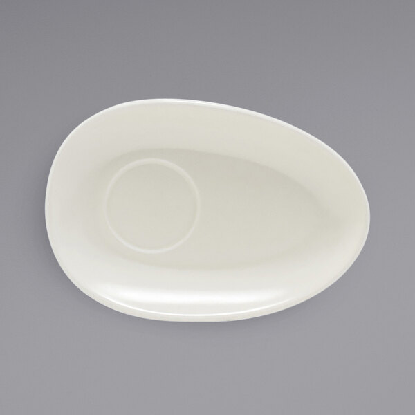 A white oval plate with a circle in it.