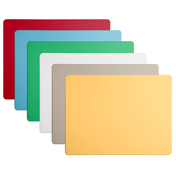 A group of rectangular Tomlinson Chef's Edge cutting boards in 4 different colors.