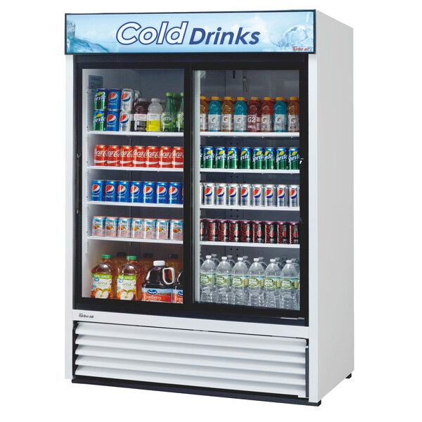 A Turbo Air white glass door refrigerator filled with beverages.