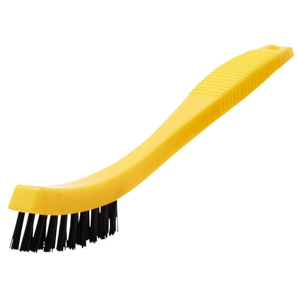 A yellow Rubbermaid tile and grout brush with black plastic bristles.