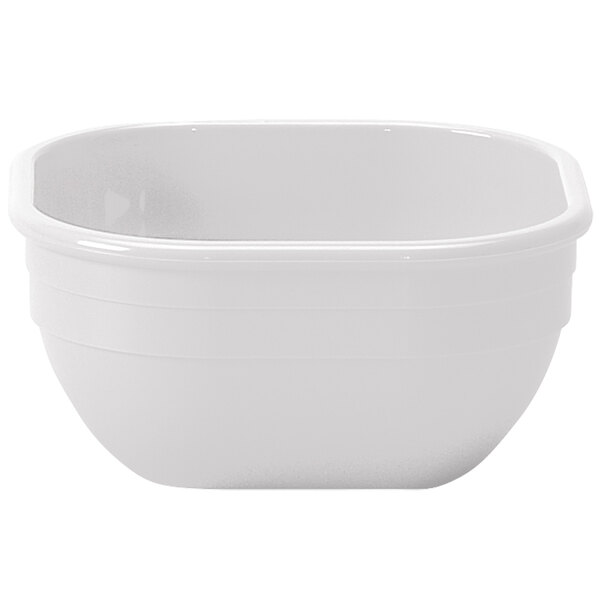 A white rectangular Cambro bowl with a handle.